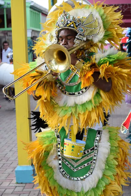 Bahamanian playing trombone in costume